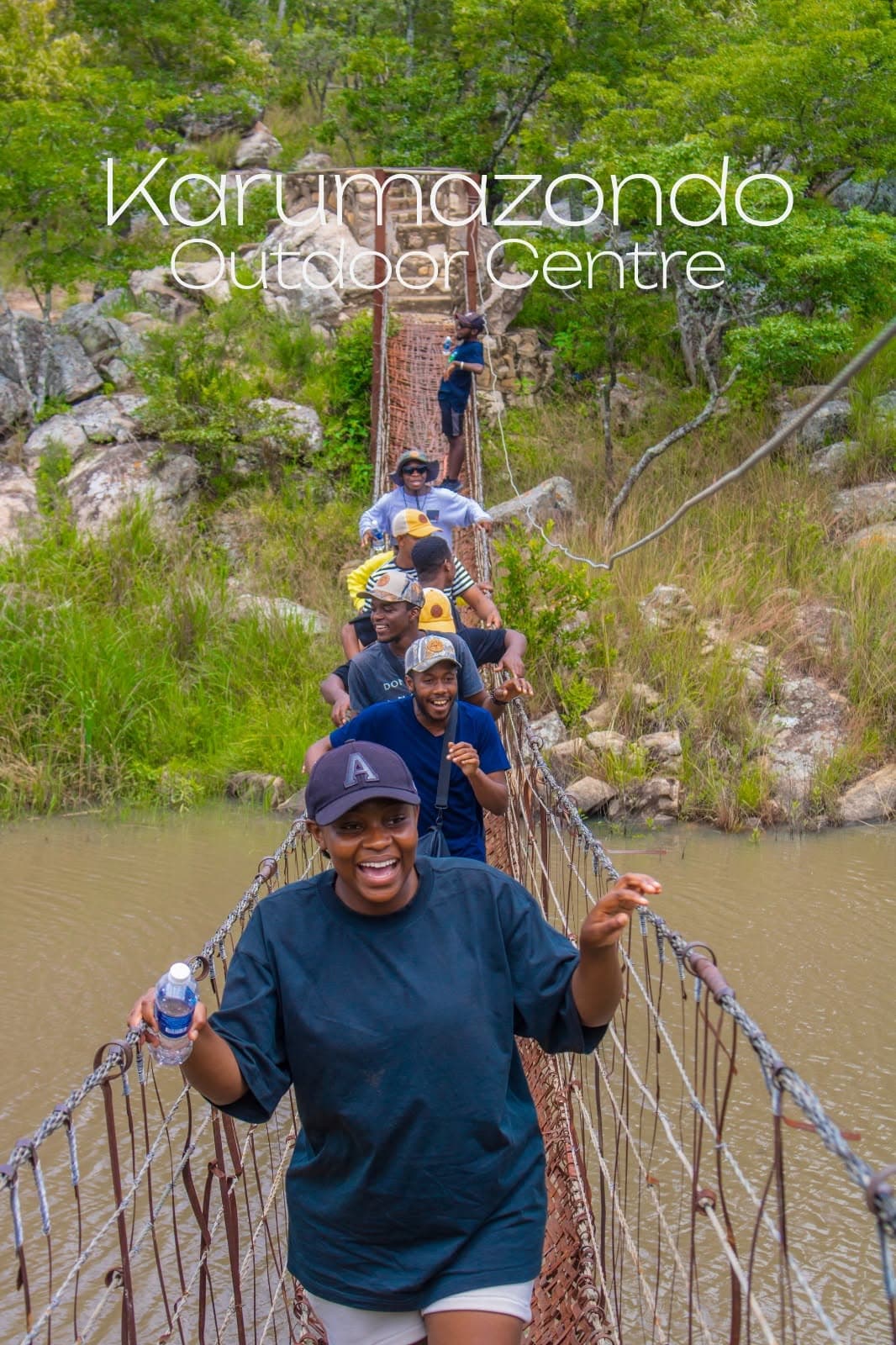 Bushwalk hikers crossing the bridge at Karumazondo Outdoor Centre